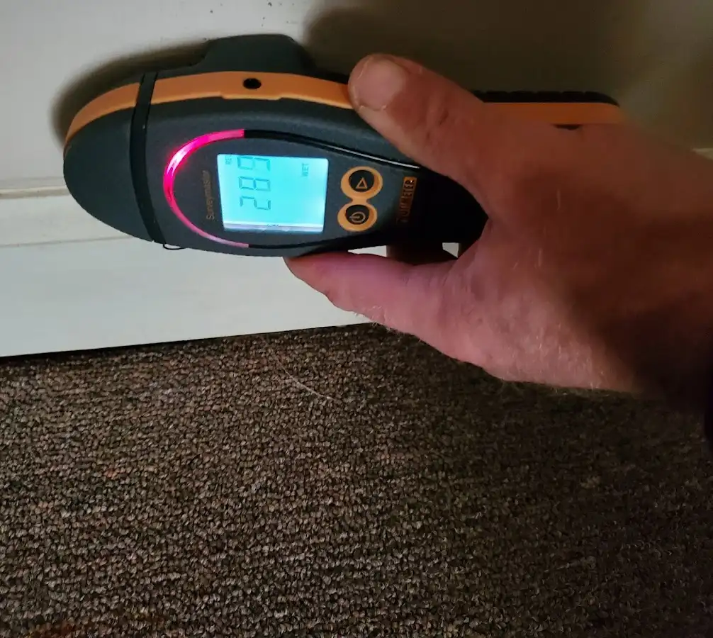 Moisture detection at baseboard during Storm Damage Restoration in West Richland